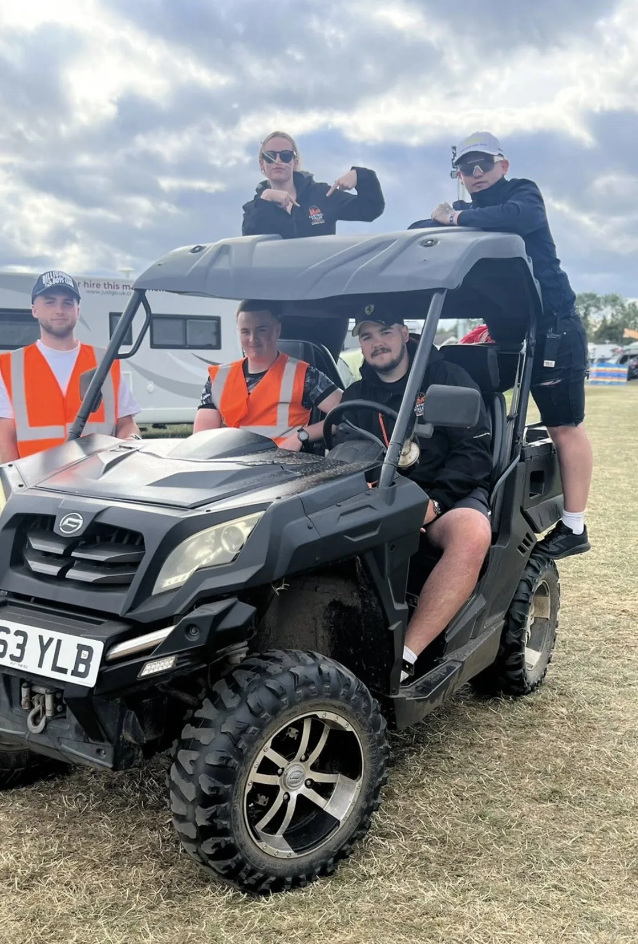 Event team posing with a site buggy