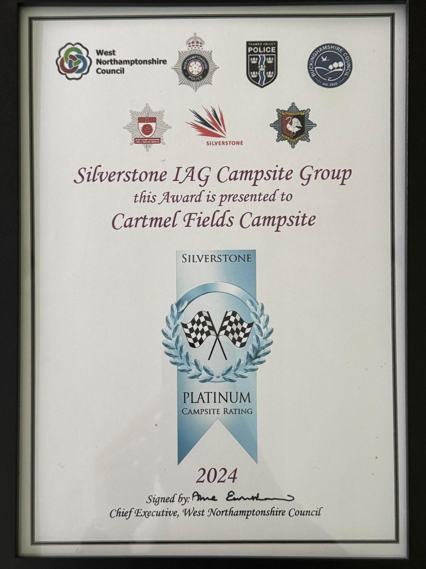 Cartmel Fields teardrop flag banner at the campsite