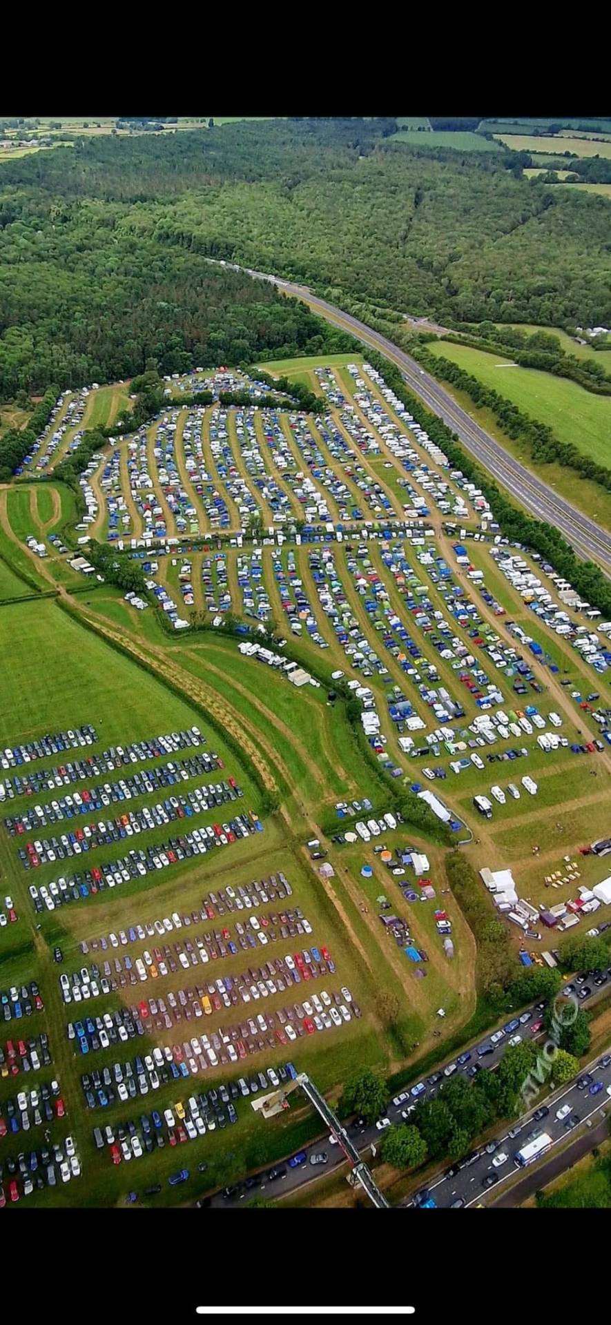 Hero aerial shot of the entire campsite showing layout and facilities