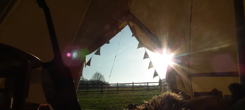 Sunlight streaming into bell tent interior