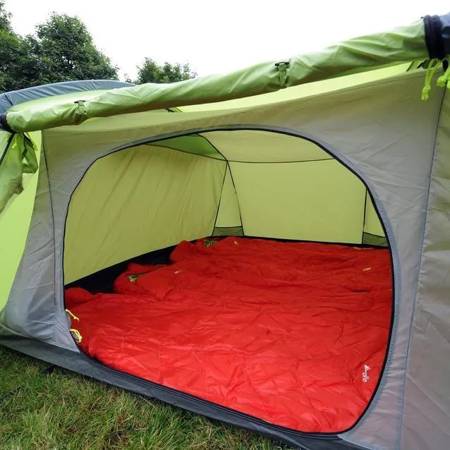 Pre-pitched tent sleeping area with comfortable camping mattresses and bedding
