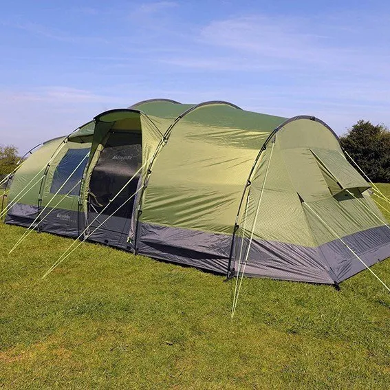 Large green family tent set up and ready for arrival at Cartmel Fields