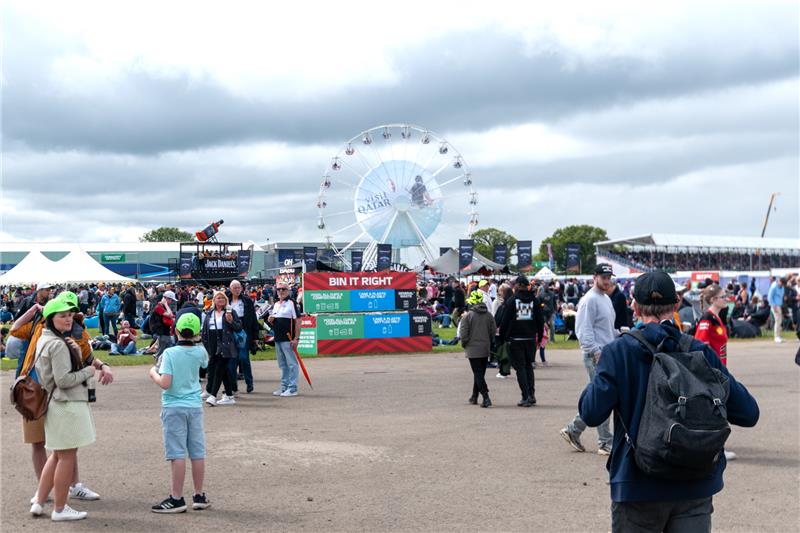 Family-friendly entertainment zone at Silverstone with Ferris wheel and children