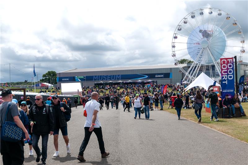Silverstone Museum entrance with Ferris wheel and Food Court in the fan zone area