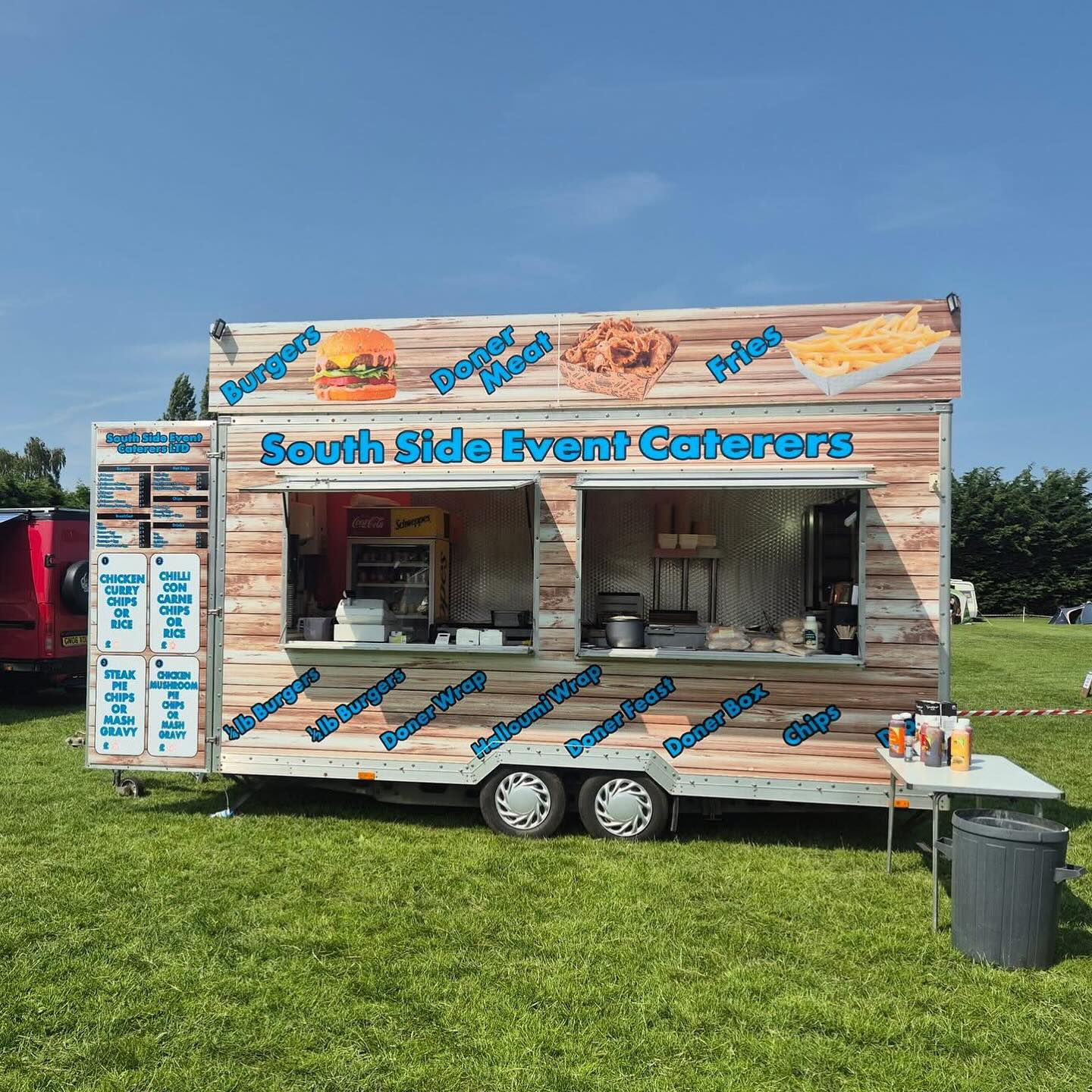 Burger vendor preparing fresh burgers at the campsite food court