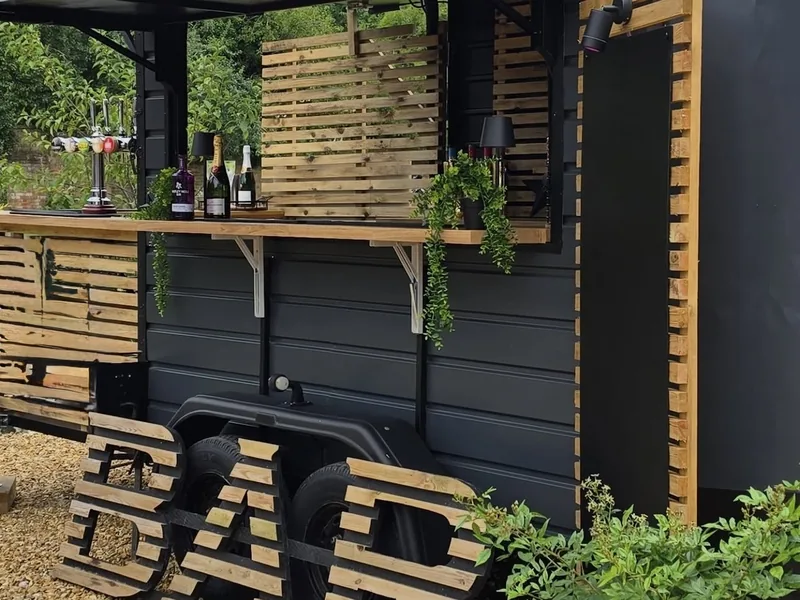 Mobile bar unit serving drinks in the camping area
